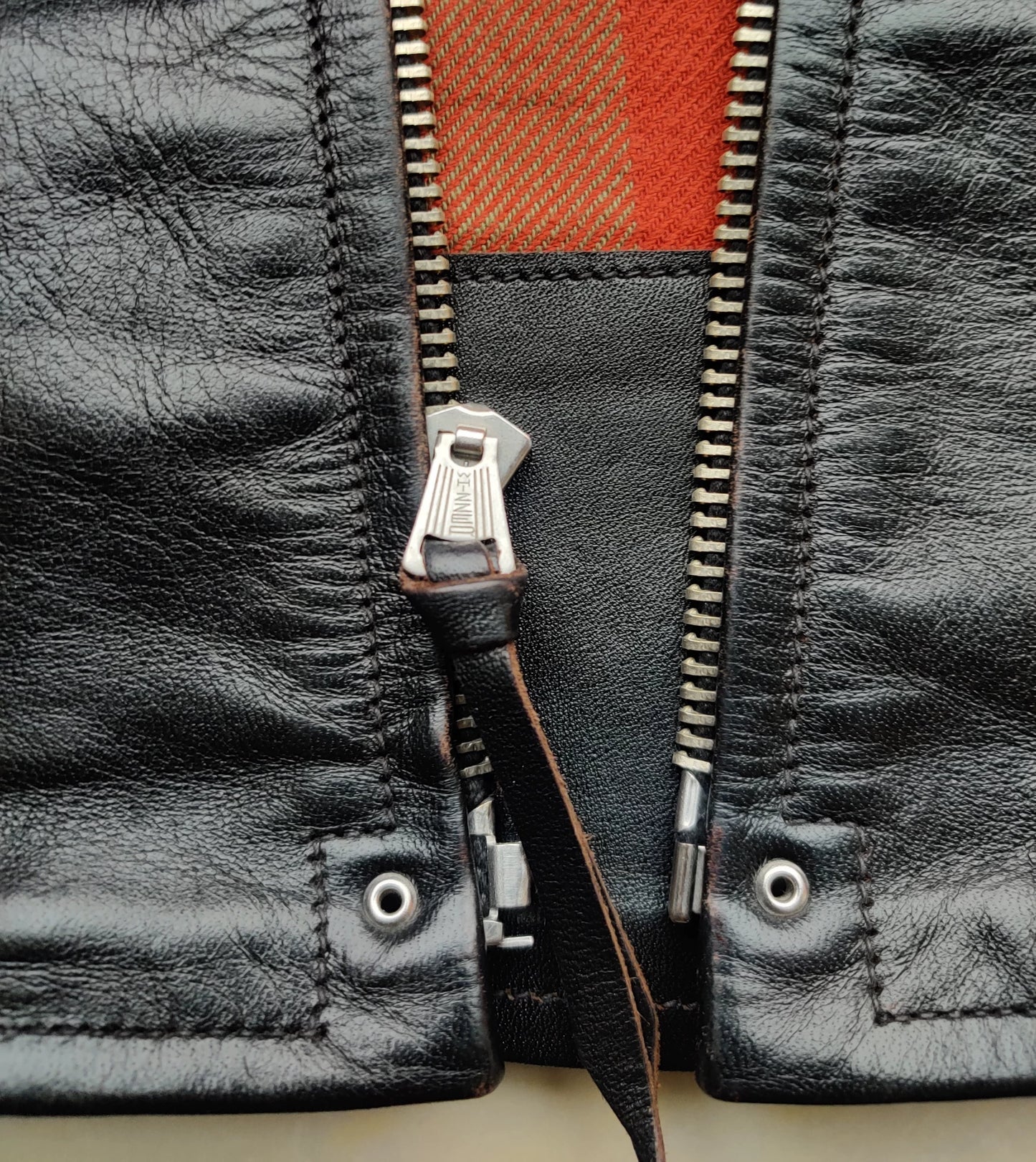 black leather jacket with snowflake pattern