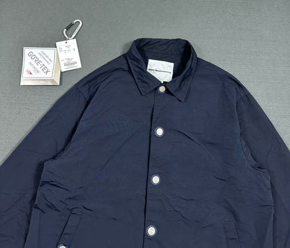 white mountaineering gore-tex coach jacket