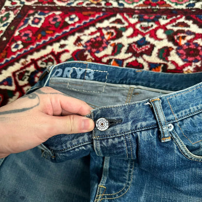 visvim mud-dyed wide-leg denim pants