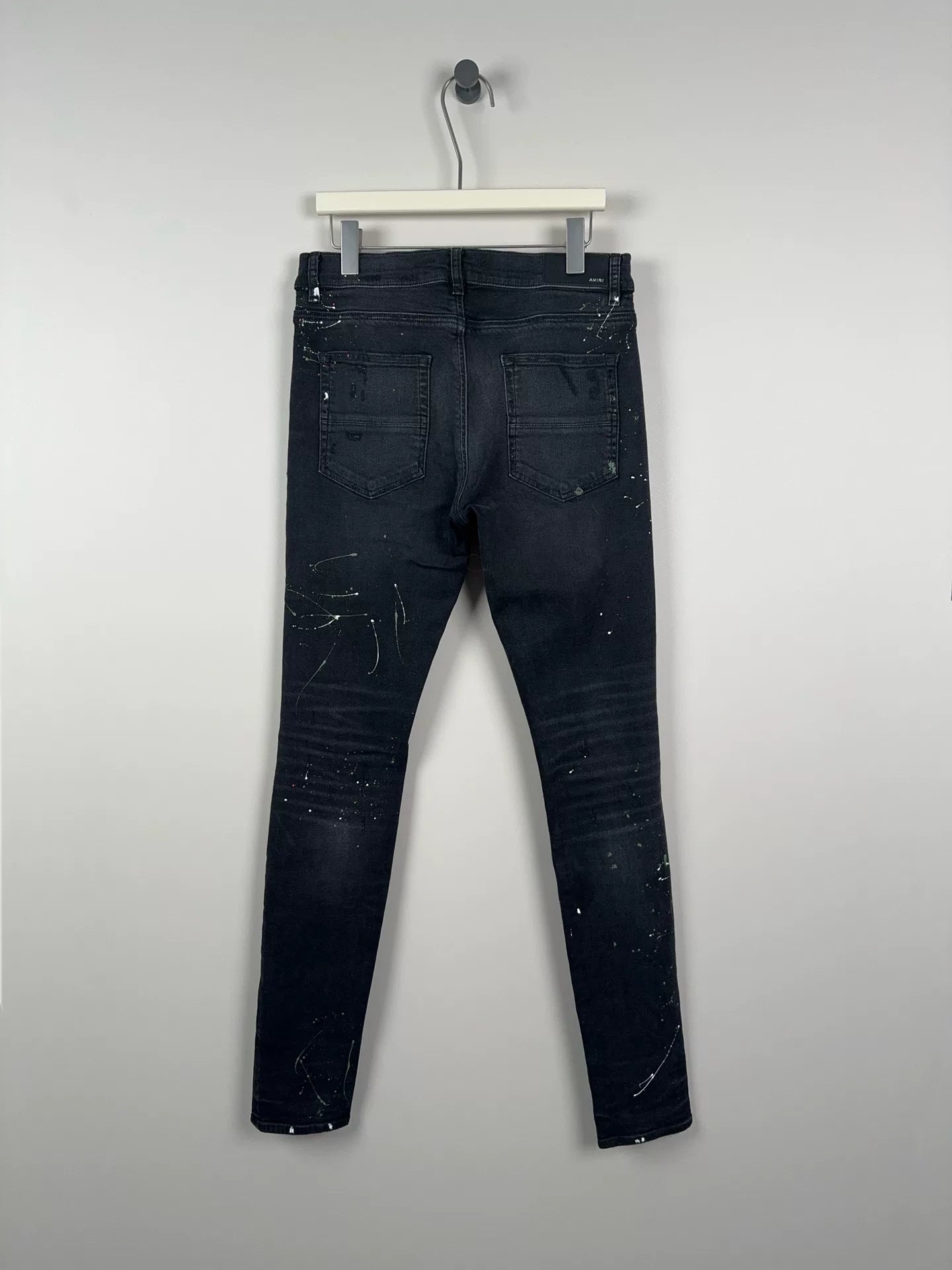 amiri crane graffiti embroidered distressed jeans