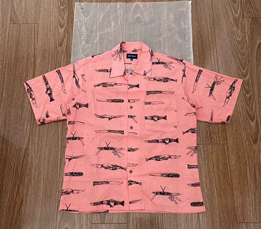 pink short sleeve shirt with fish print