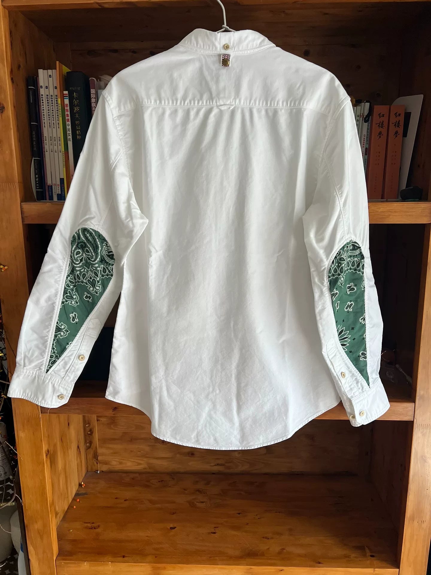 white drop sleeve shirt with paisley design