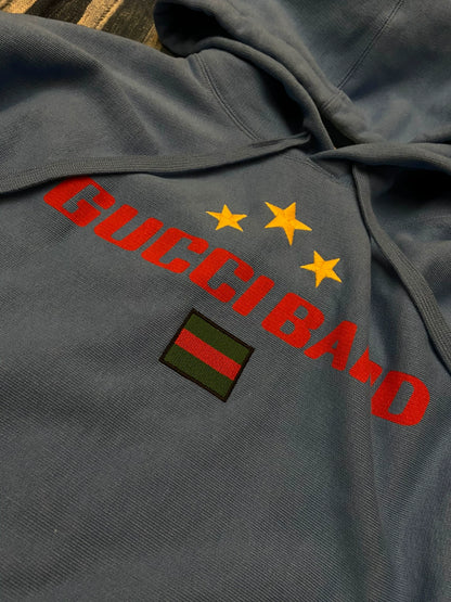 gucci blue hoodie with logo and stars
