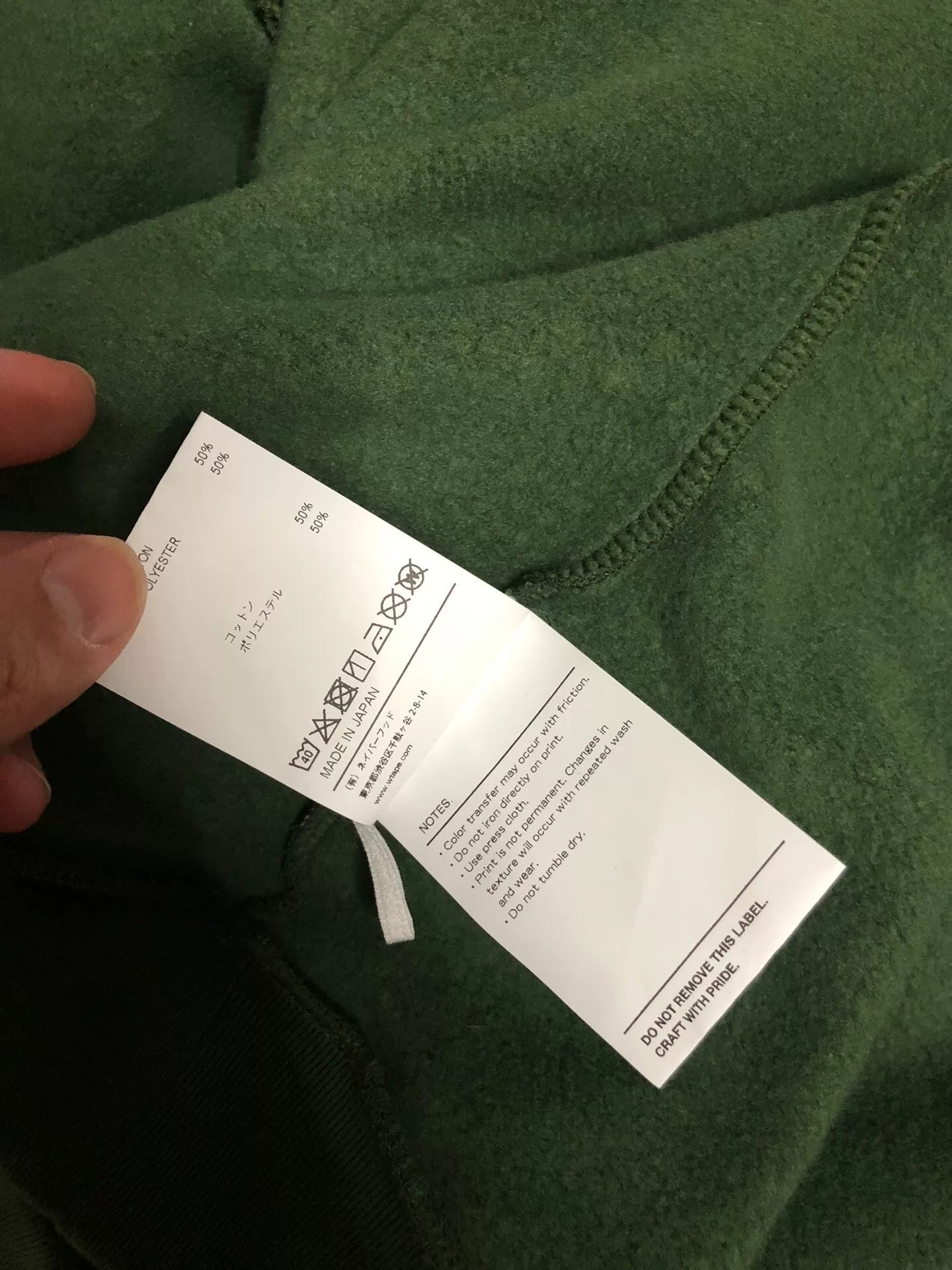 wtaps green pullover sweatshirt with text