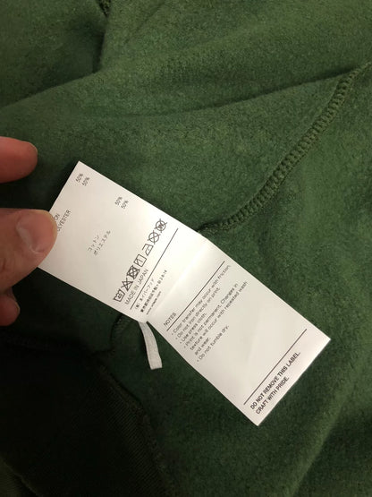 wtaps green pullover sweatshirt with text