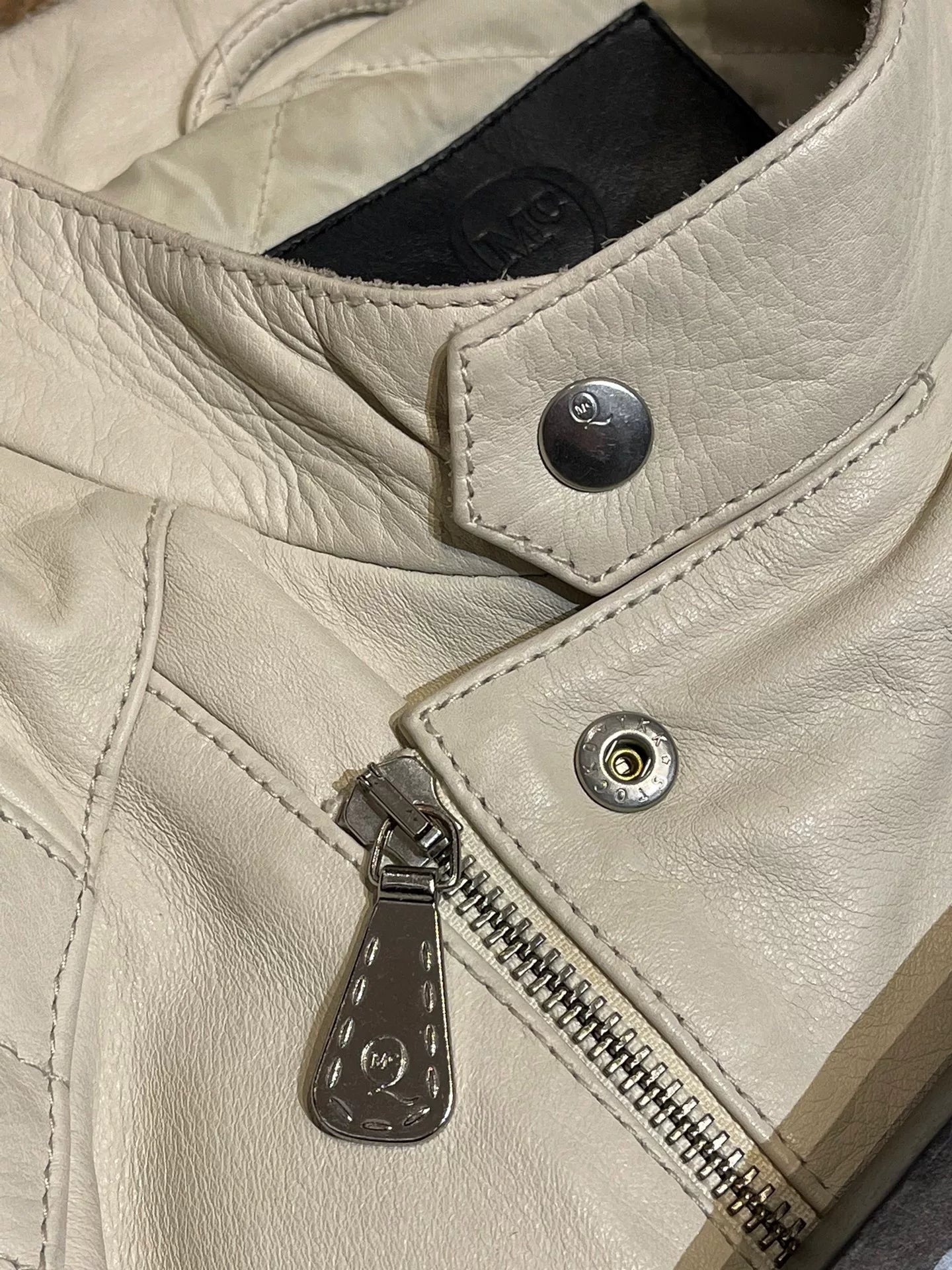 white leather motorcycle jacket by Alexander McQueen