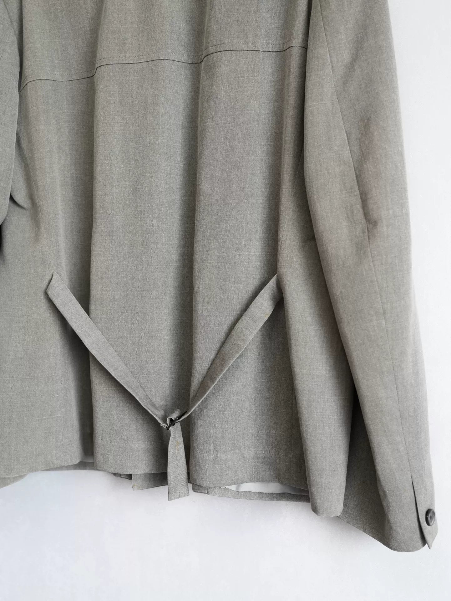 double-breasted concrete gray jacket