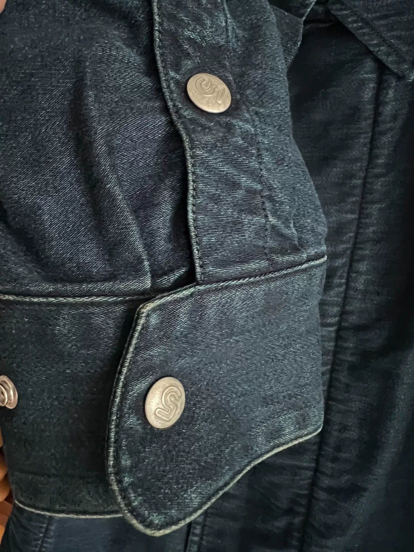 blue dyed motorcycle jacket with subtle vintage touch