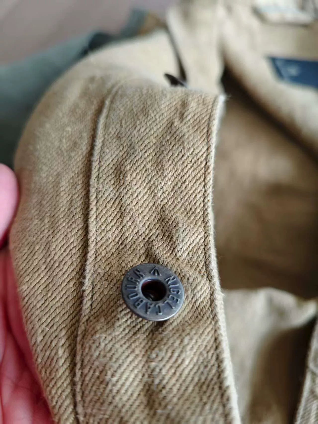 vintage military-style denim jacket