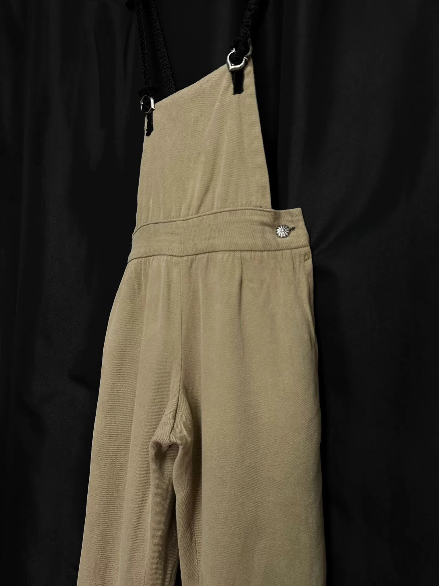 beige velvet overalls with silver buckles