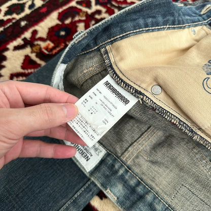 distressed blue jeans with unique detailing