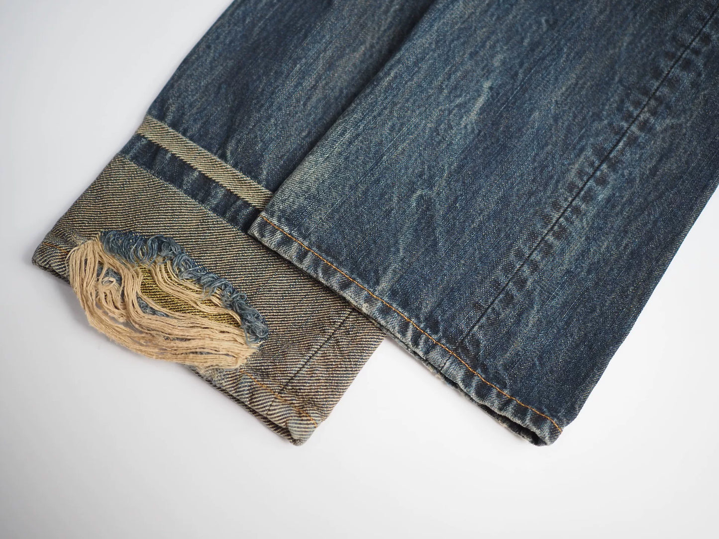 blue denim jeans with gold detail