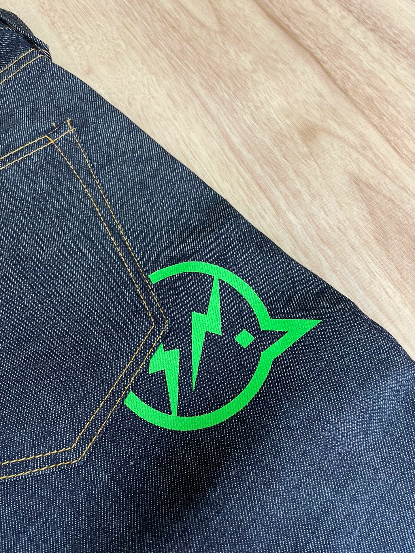 denim by vanquish green logo cropped jeans