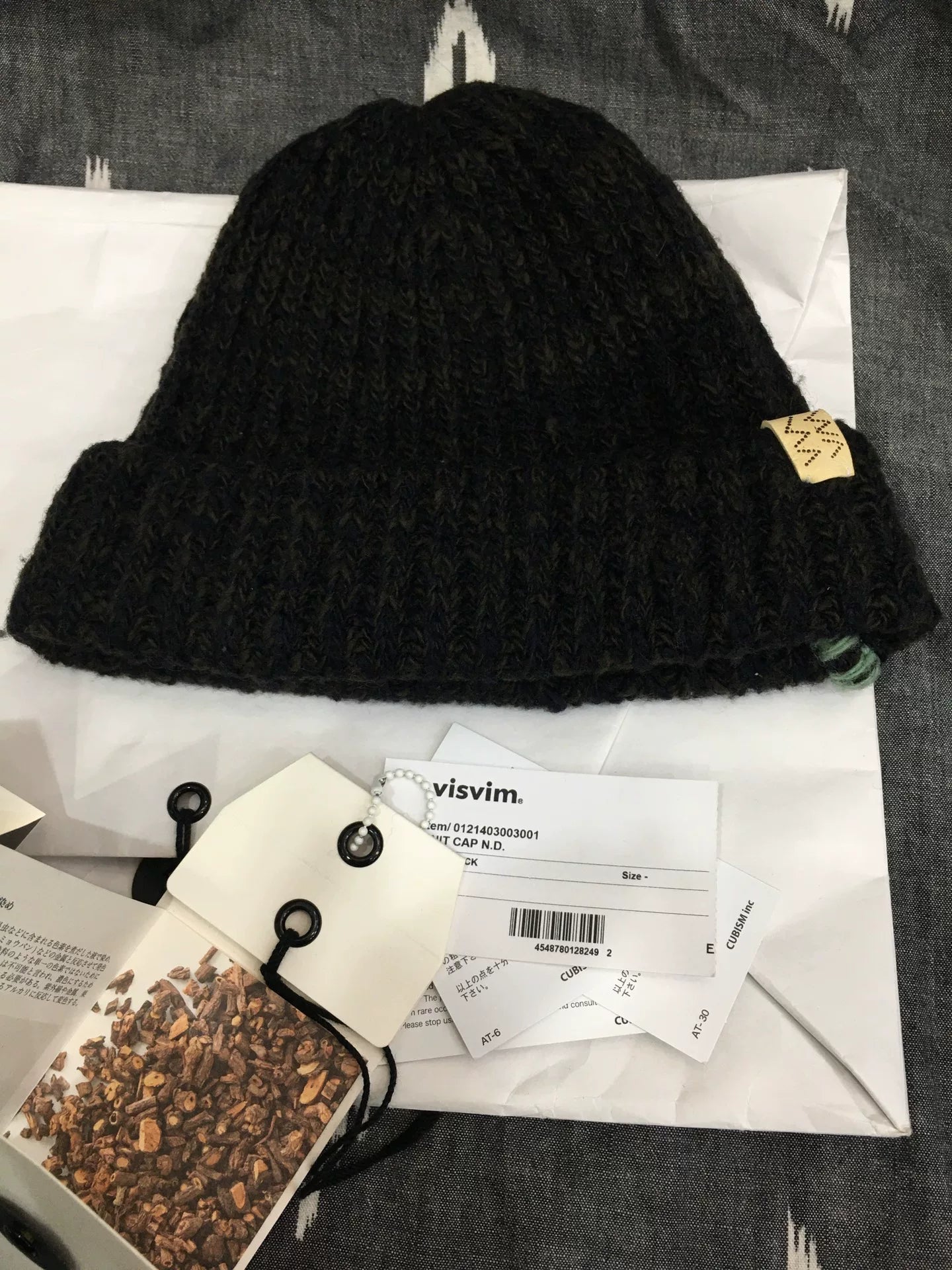 visvim black knit cap with mud dye technique