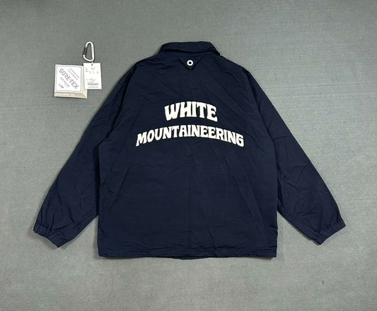 white mountaineering gore-tex coach jacket