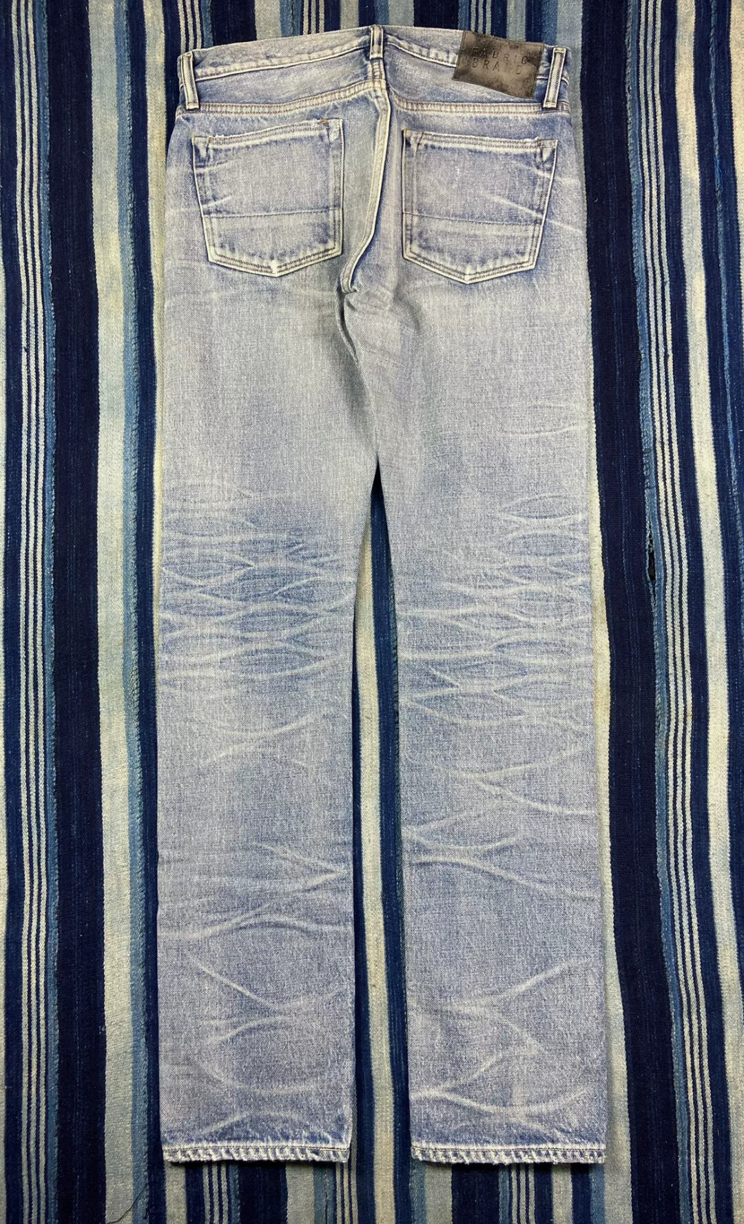 distressed raw wash denim jeans by fabric-brand&co