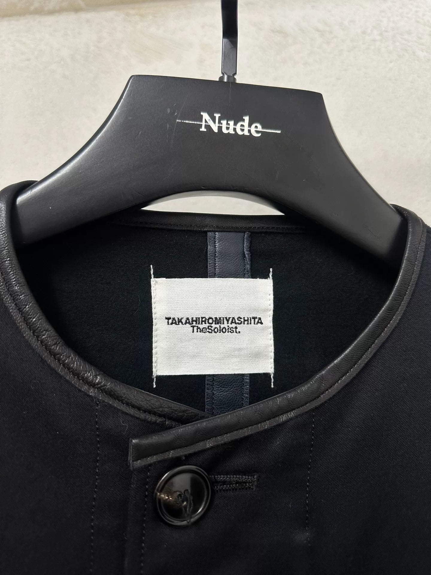 black oversized jacket with frayed hem