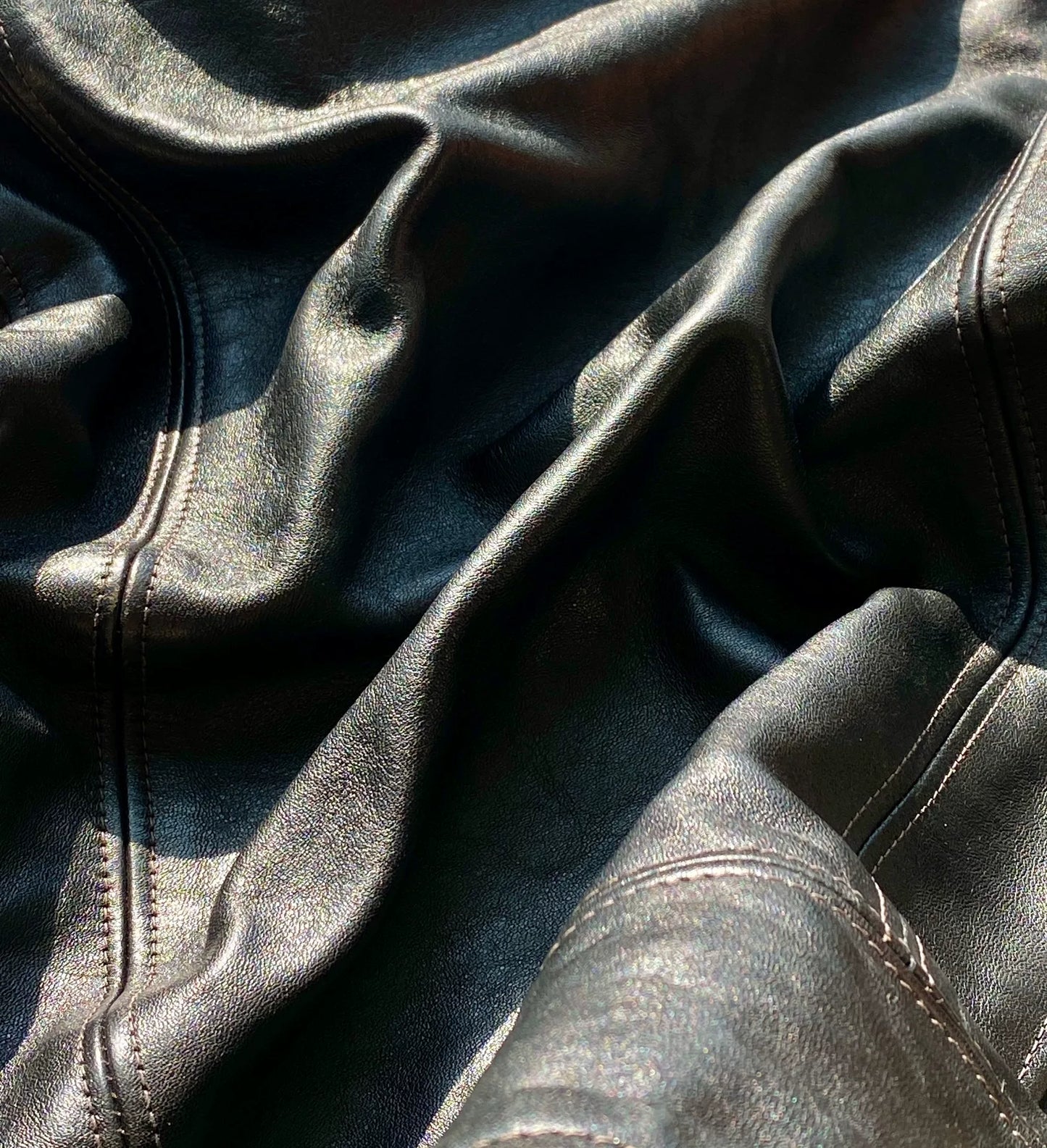 black leather biker jacket with detailed embellishments