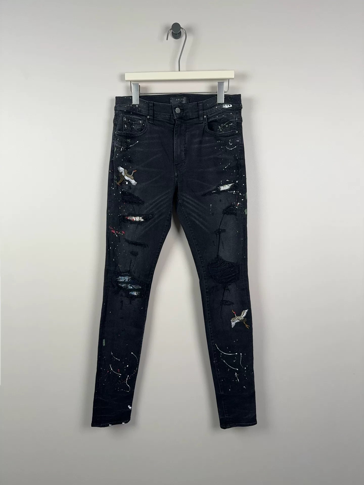 amiri crane graffiti embroidered distressed jeans