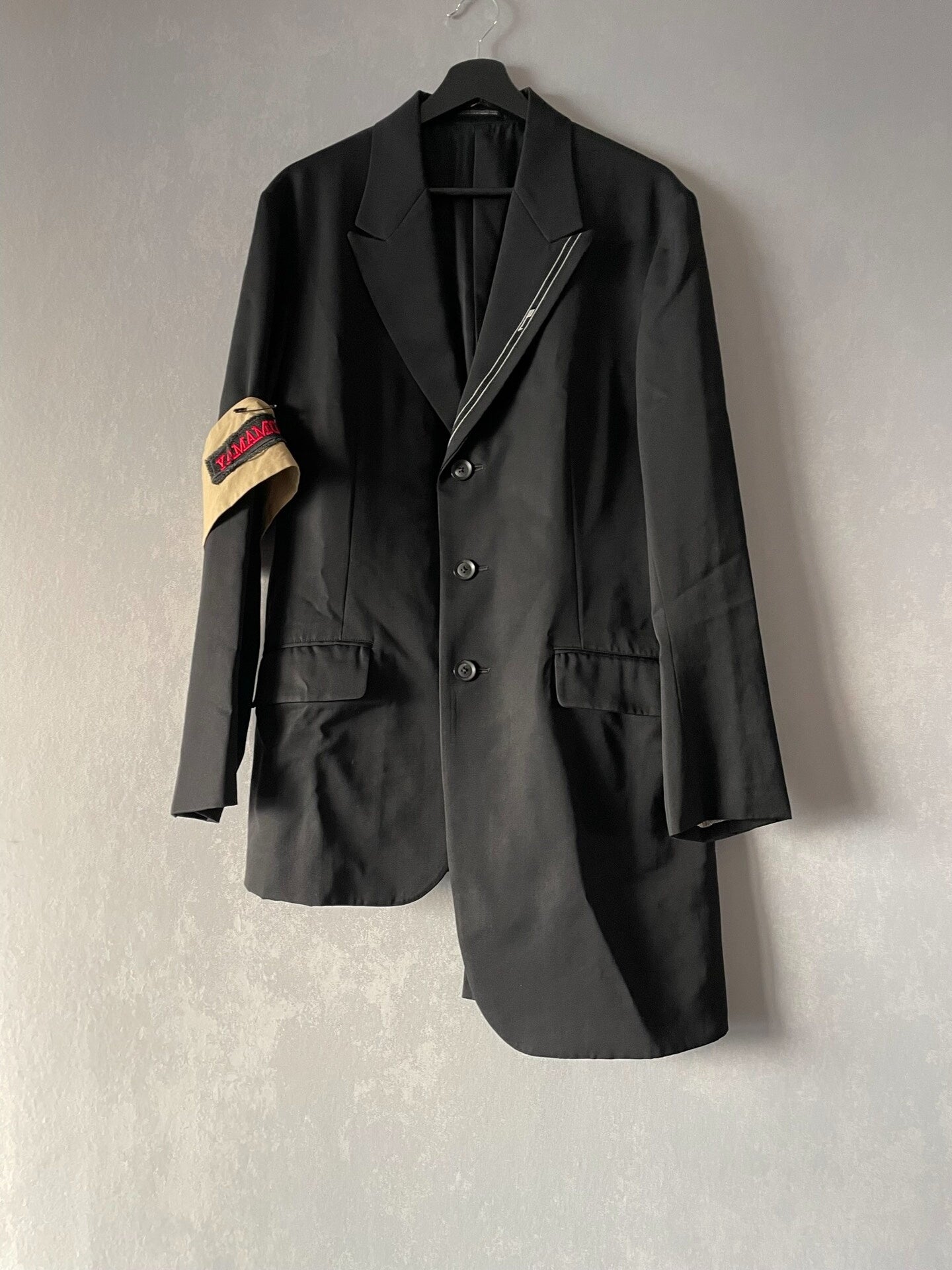 asymmetrical jacket with sleeve patch by yohji yamamoto