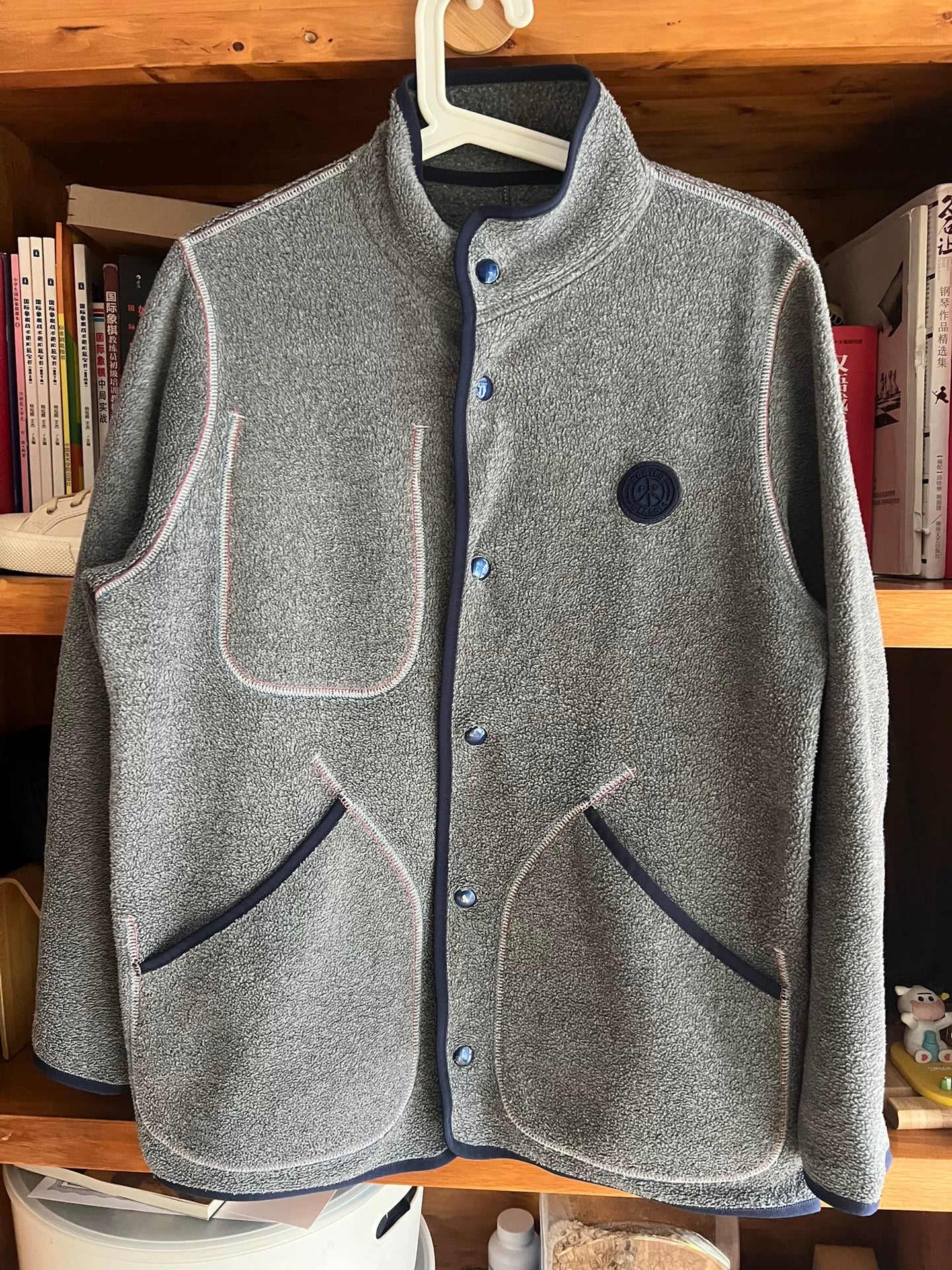 stylish gray fleece jacket with blue accents