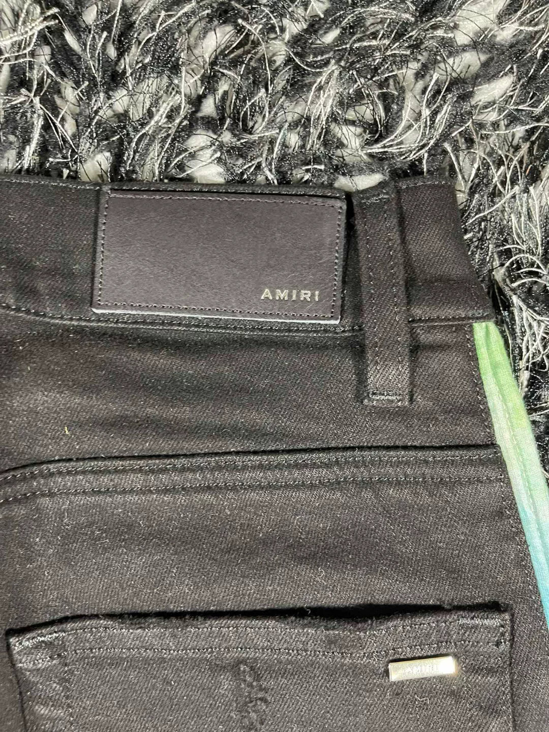 amiri watercolor half track jean