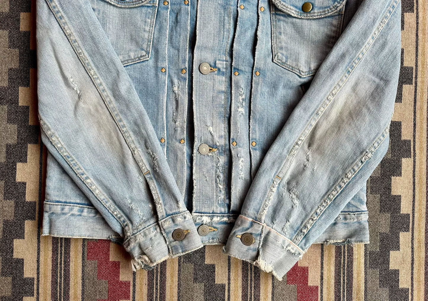 denim jacket with distressed details