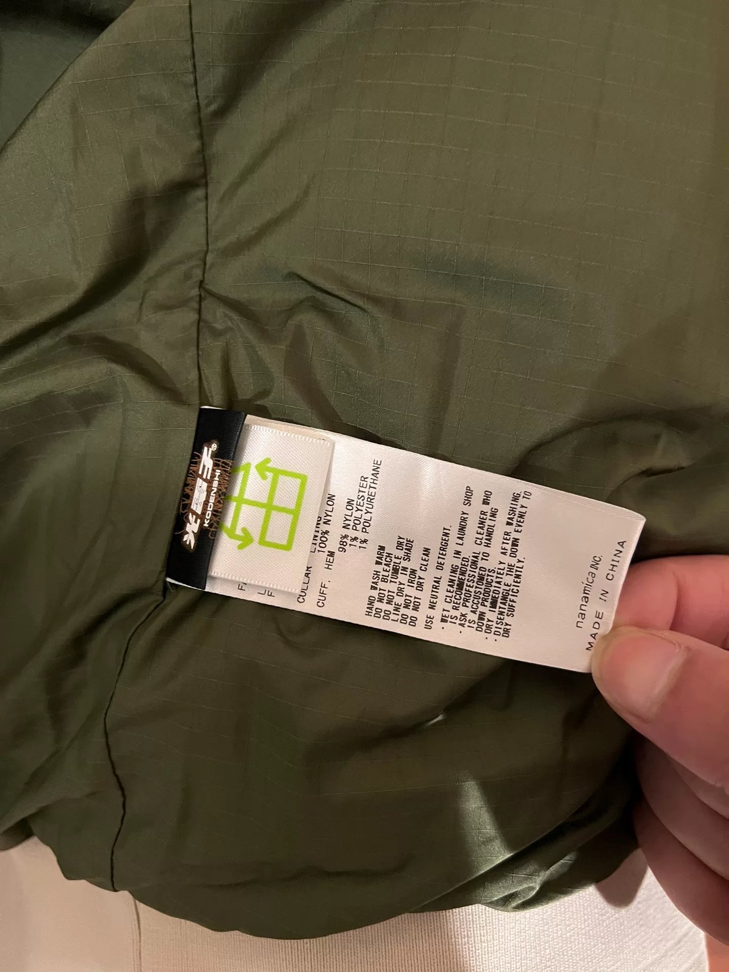 beige north face down jacket