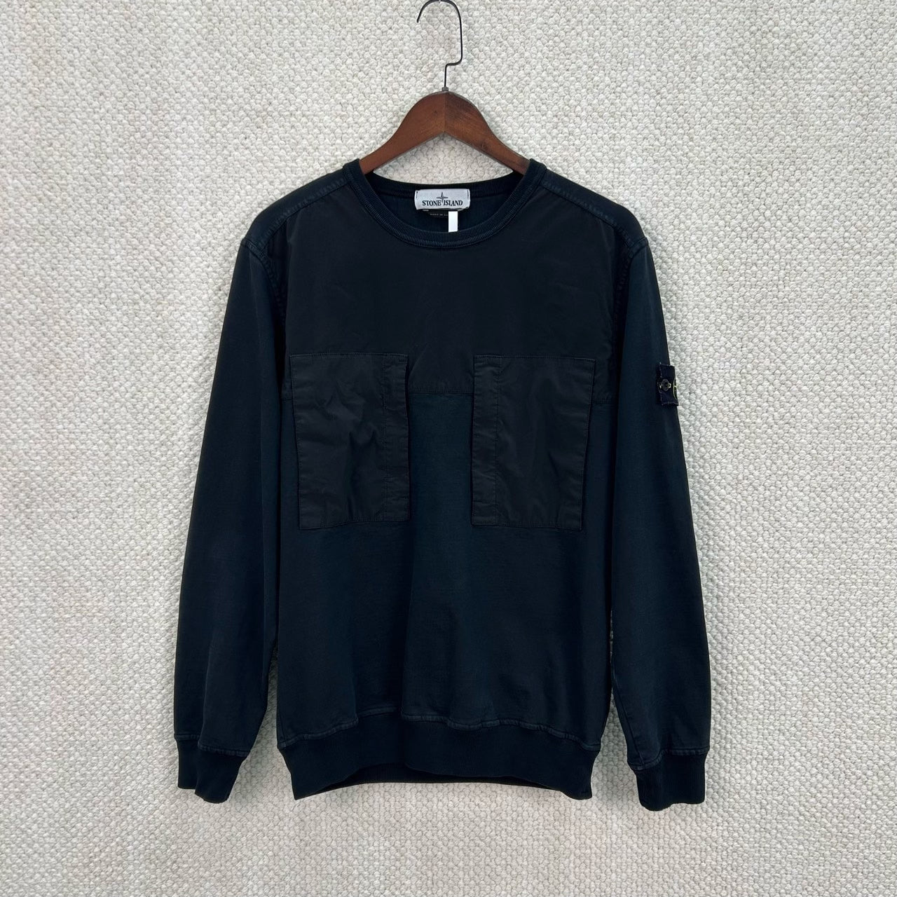 classic black patchwork sweatshirt in size M