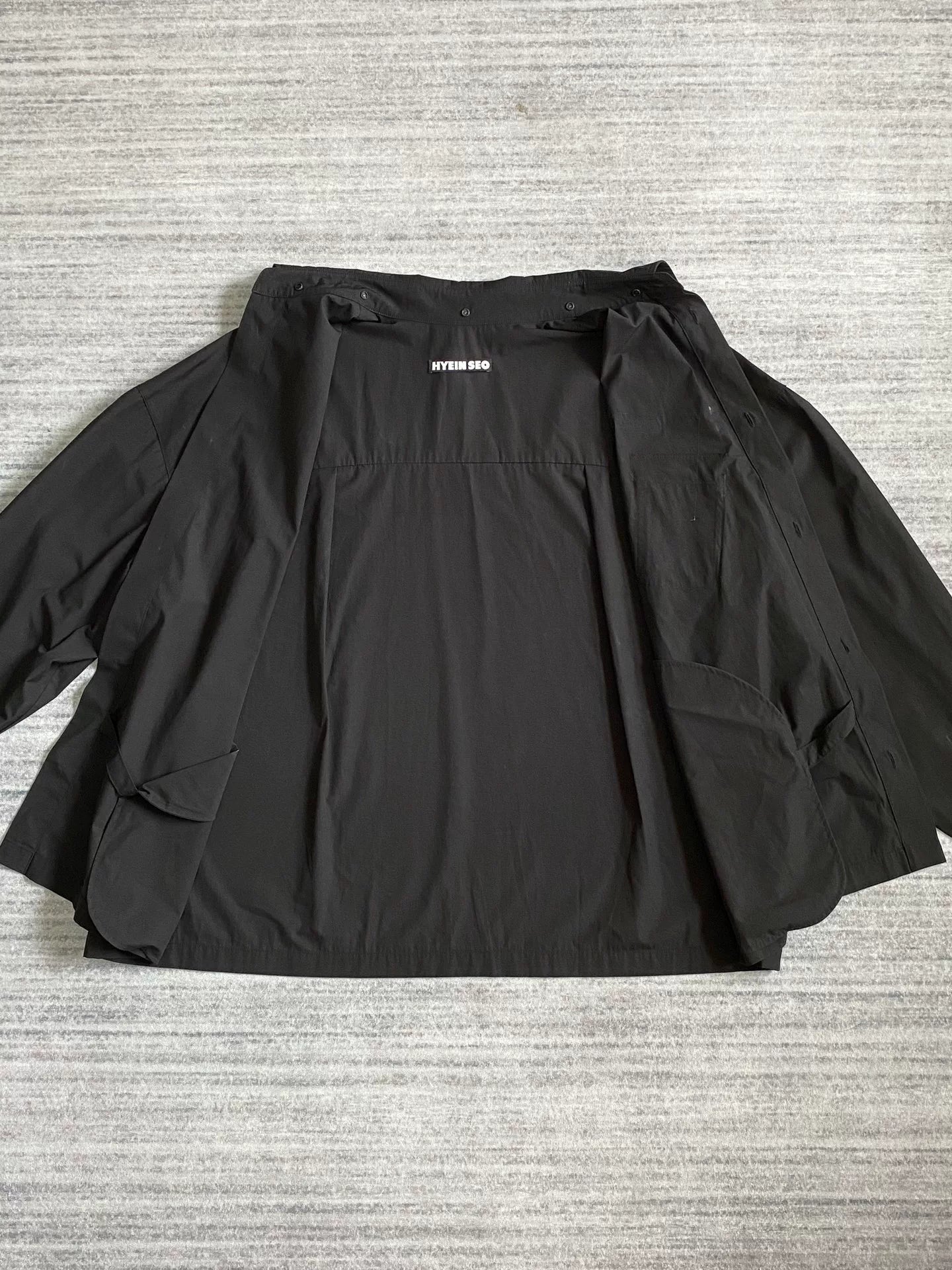 black pocket shirt with hidden buttons