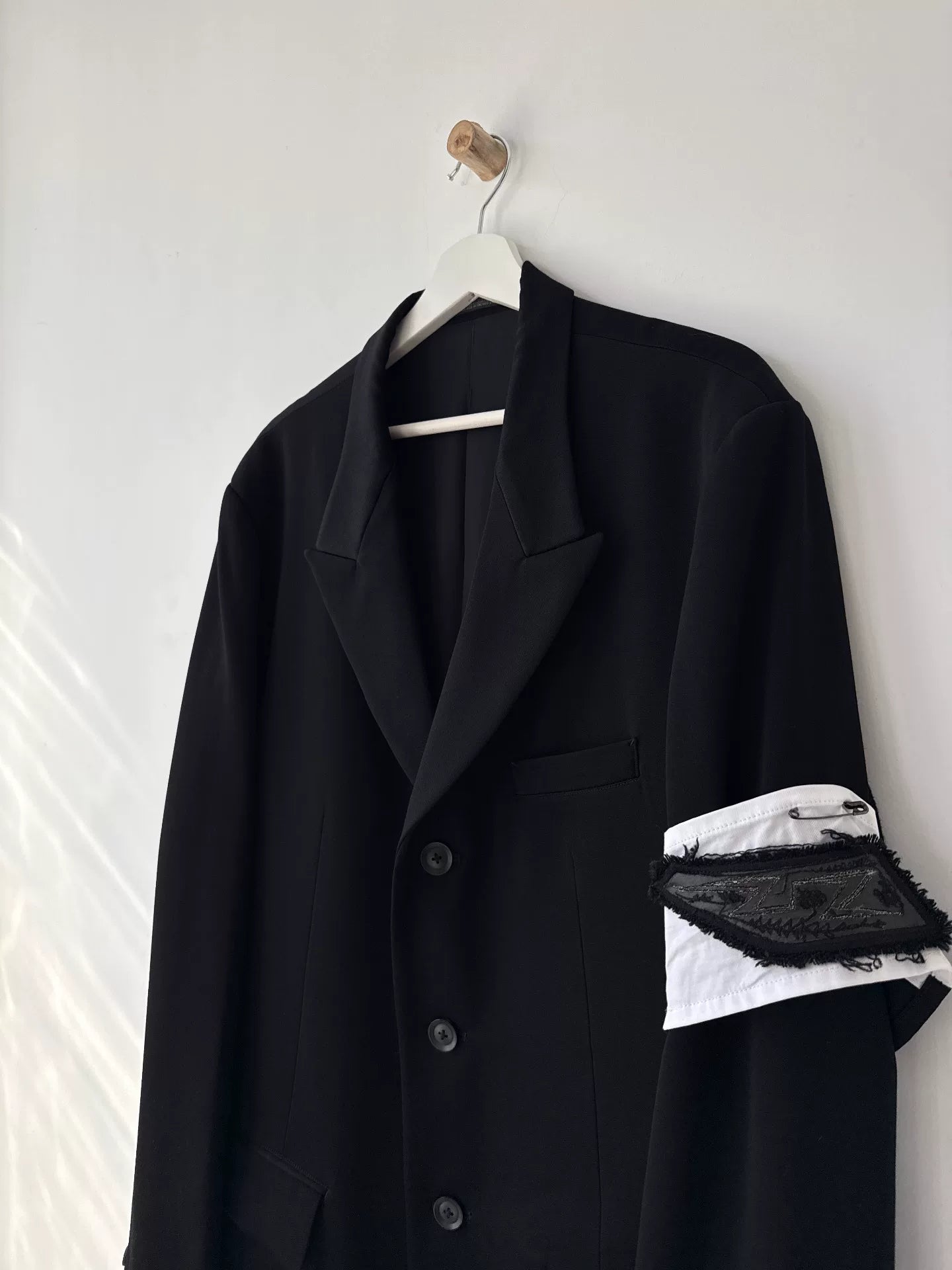 black wool suit jacket with white detail