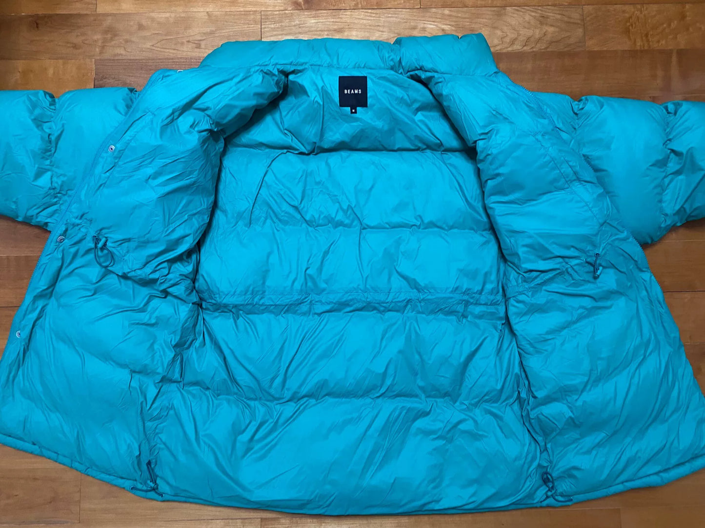 stylish teal puffer jacket for winter wear
