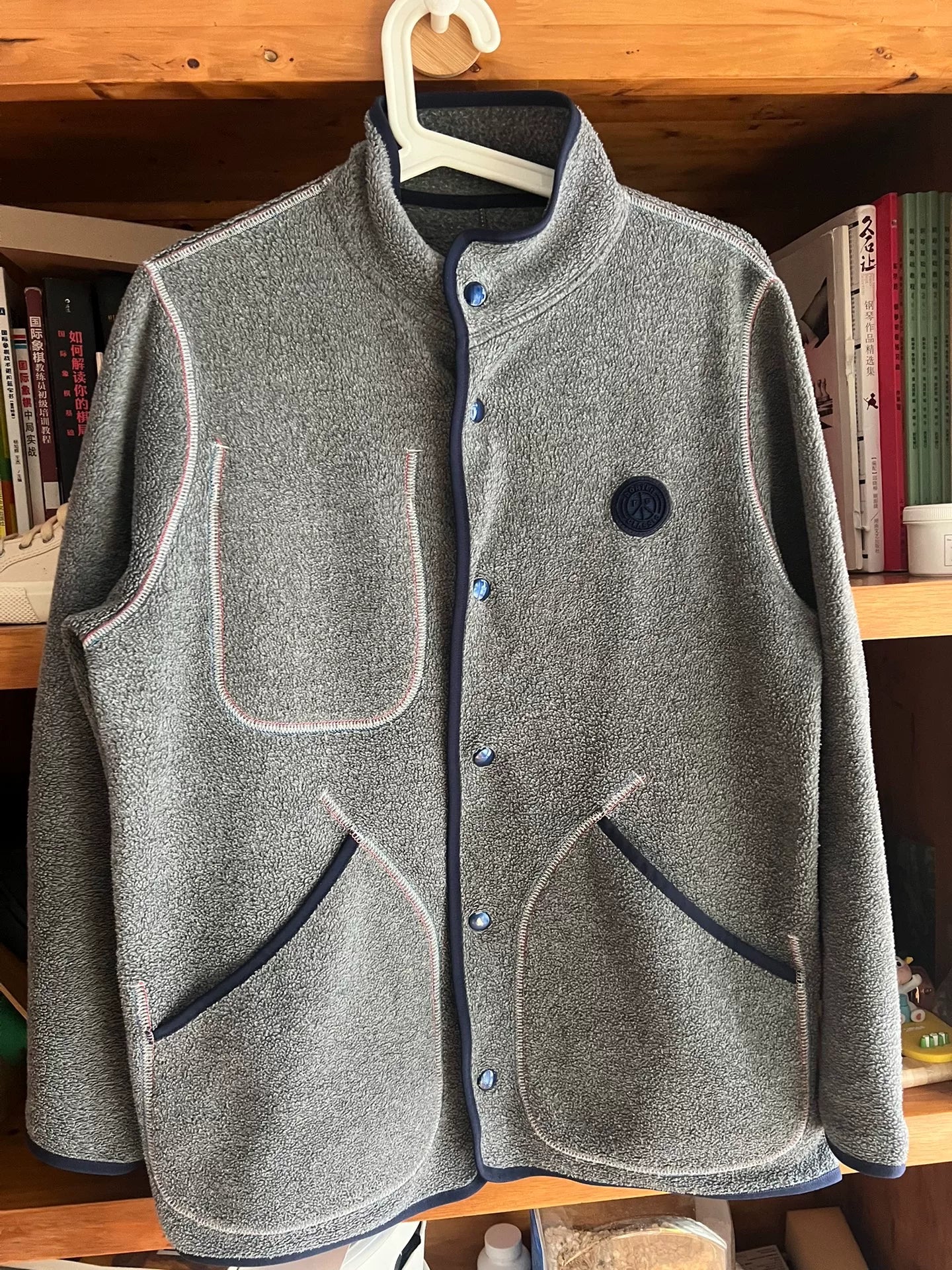 stylish gray fleece jacket with blue accents
