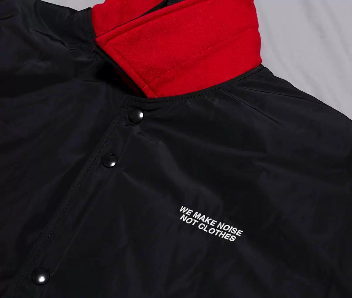 undercover coach jacket with red collar