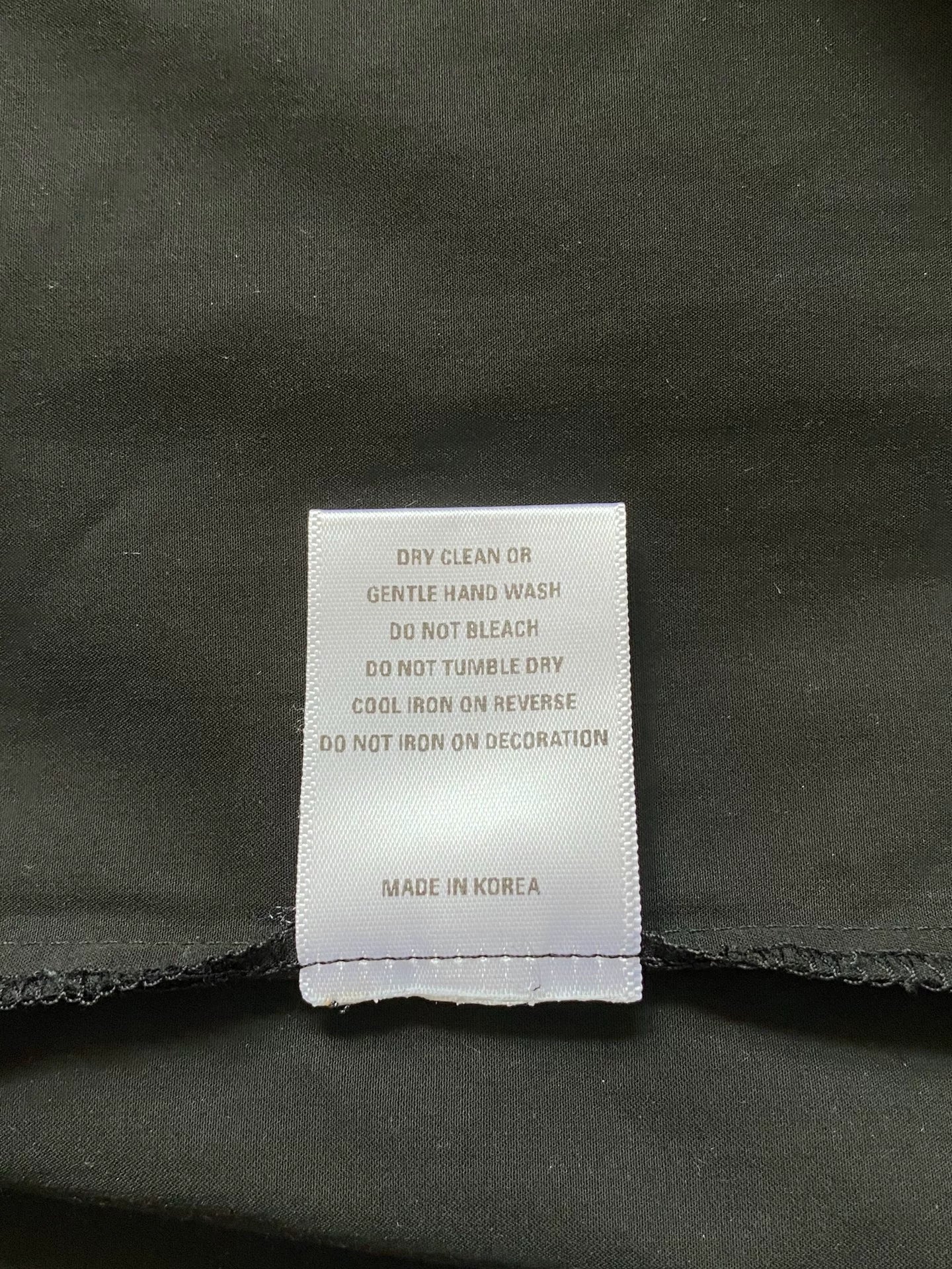 black pocket shirt with hidden buttons