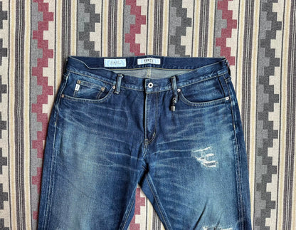 fdmtl slim fit denim with repair patches