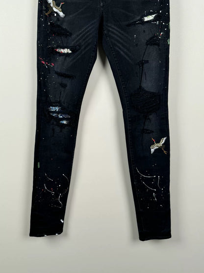 amiri crane graffiti embroidered distressed jeans