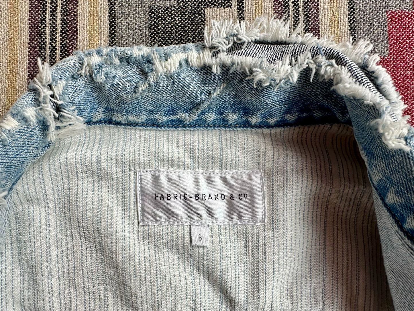 denim jacket with distressed details