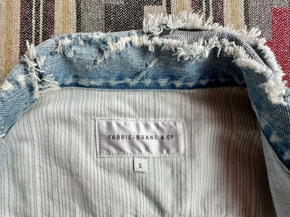 denim jacket with distressed details