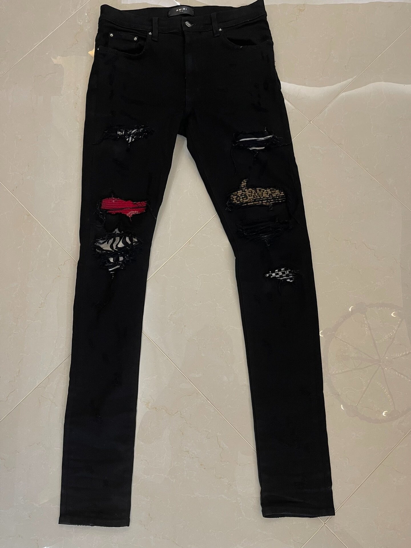 Amiri Black Denim Pants with Artistic Features
