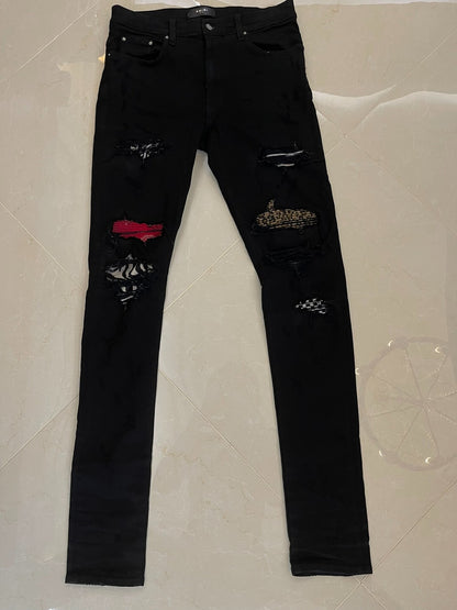 Amiri Black Denim Pants with Artistic Features