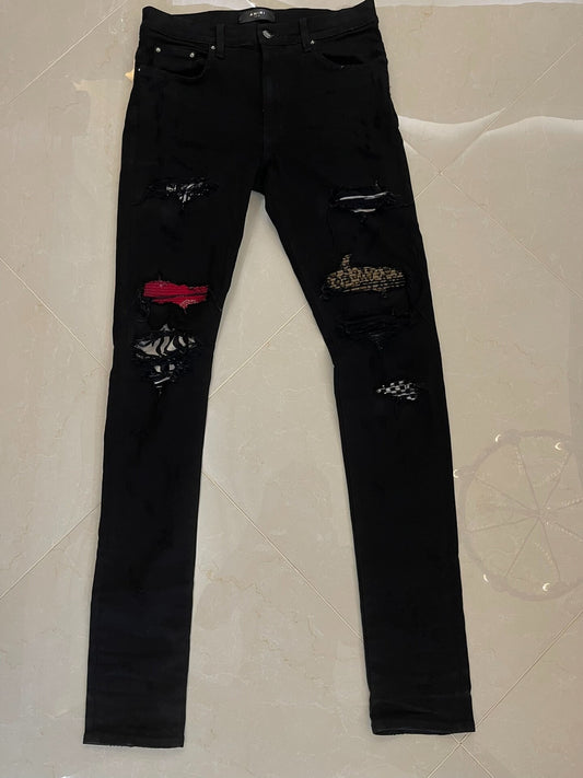 Amiri Black Denim Pants with Artistic Features