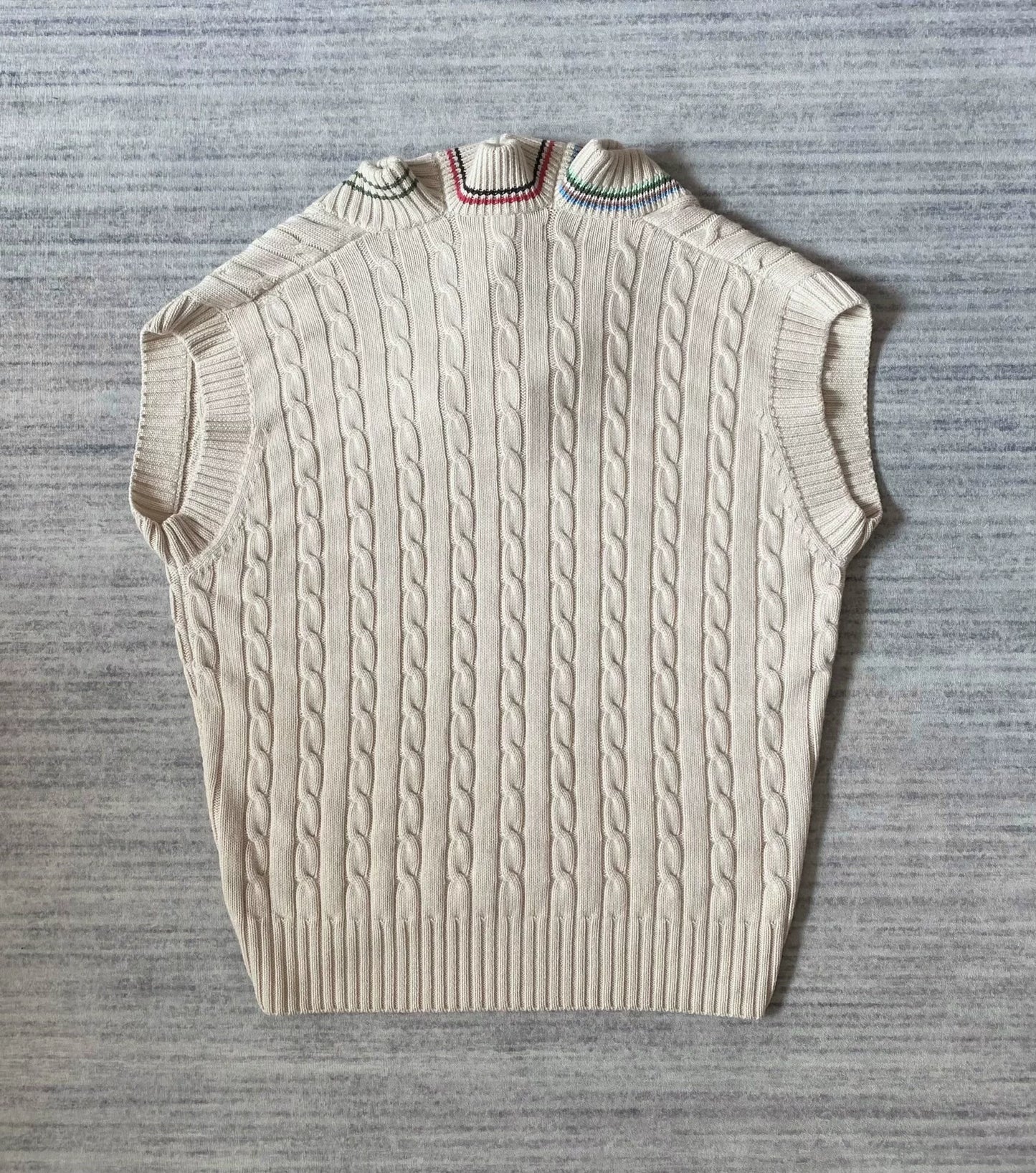 asymmetric knitted vest with multiple collars