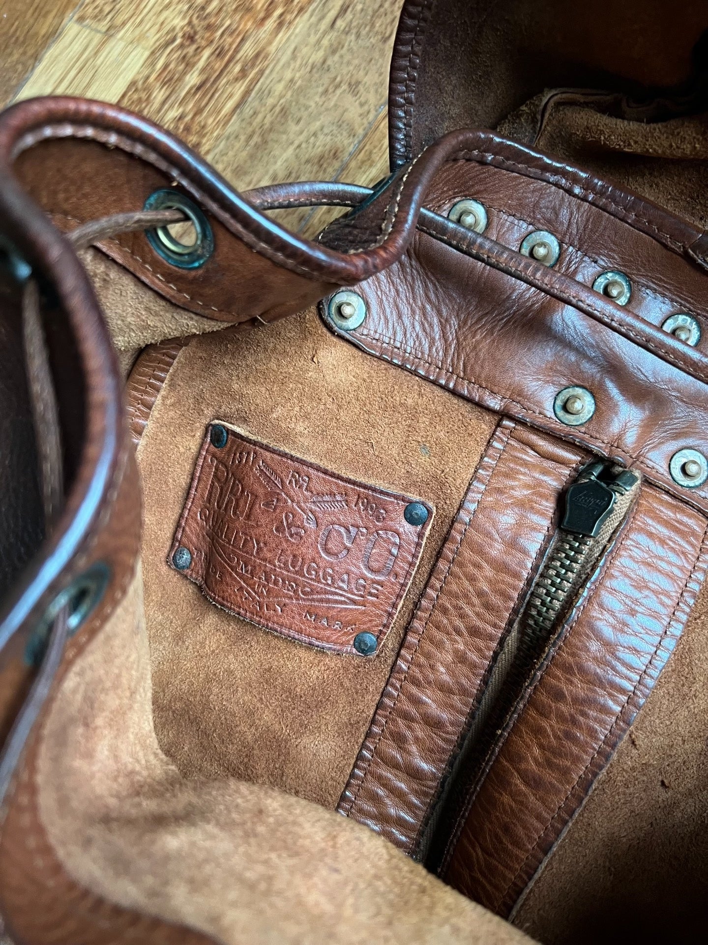 brown leather RRL backpack with pockets