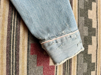 denim jacket with distressed details