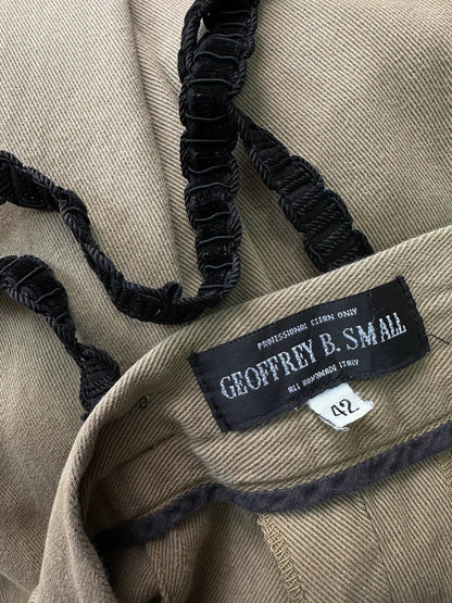 beige velvet overalls with silver buckles