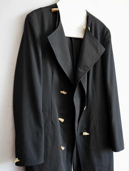 black double-breasted horn-button coat