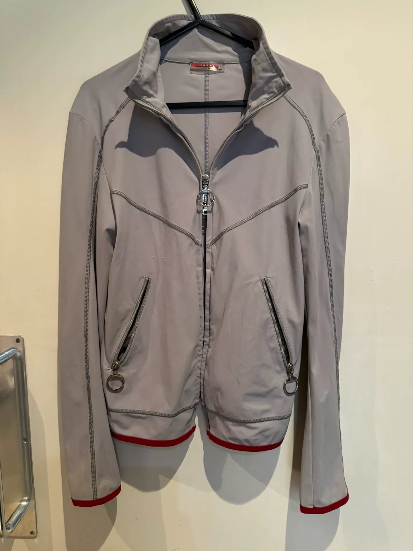 prada sport short jacket with red details