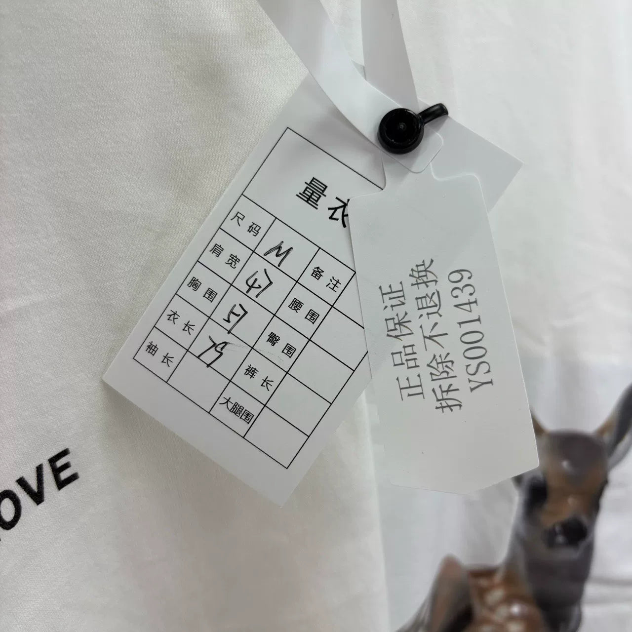 white graphic t-shirt with deer print