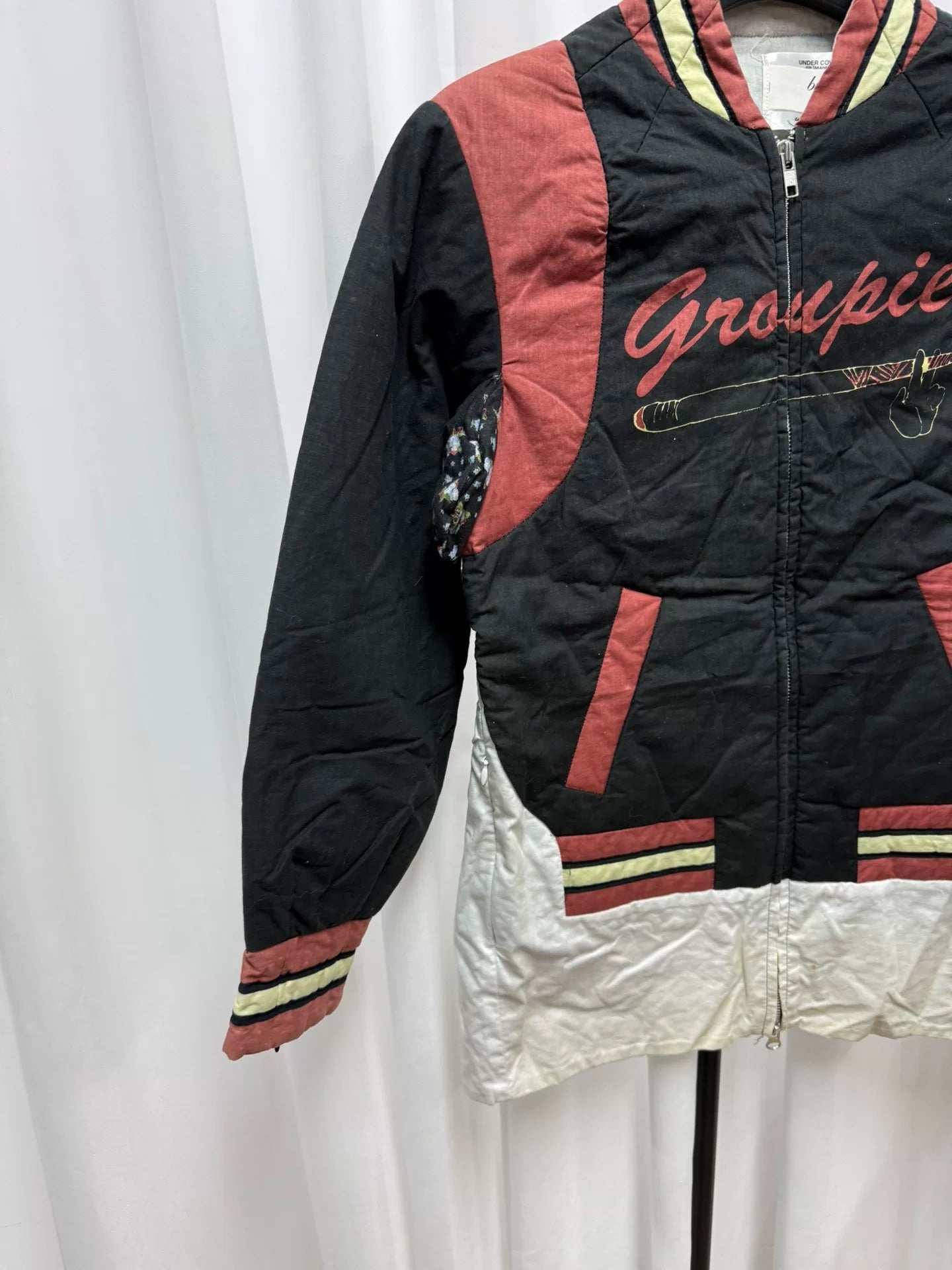 undercover bomber jacket with red accents